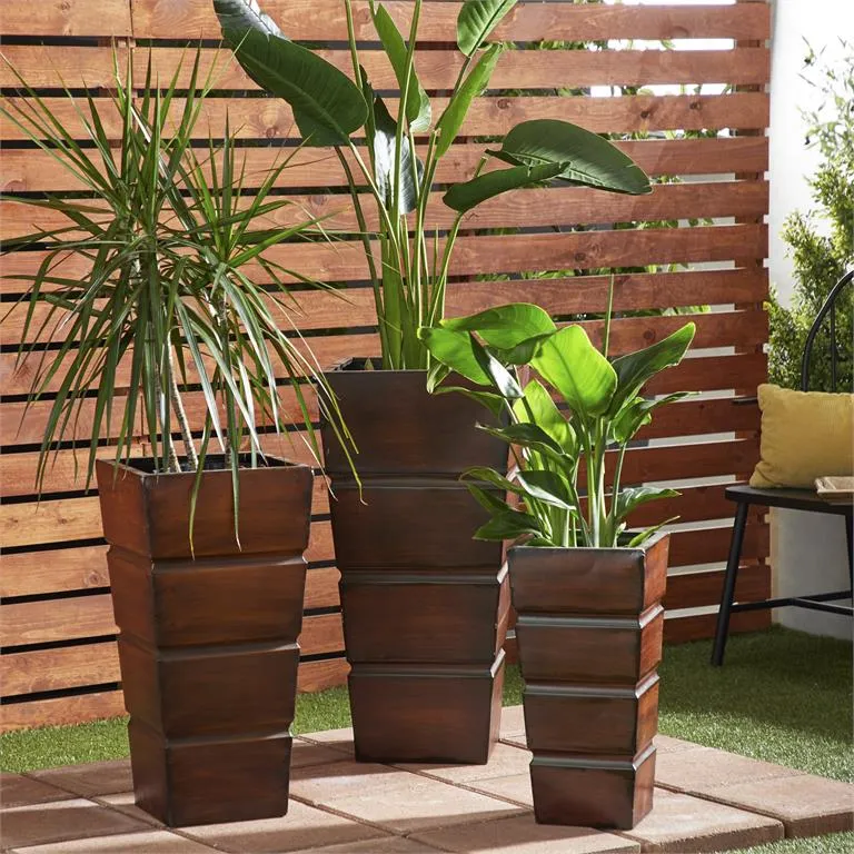 BROWN METAL INDOOR OUTDOOR LIGHT WEIGHT PLANTER WITH TAPERED BASE AND FLUTED DESIGN
